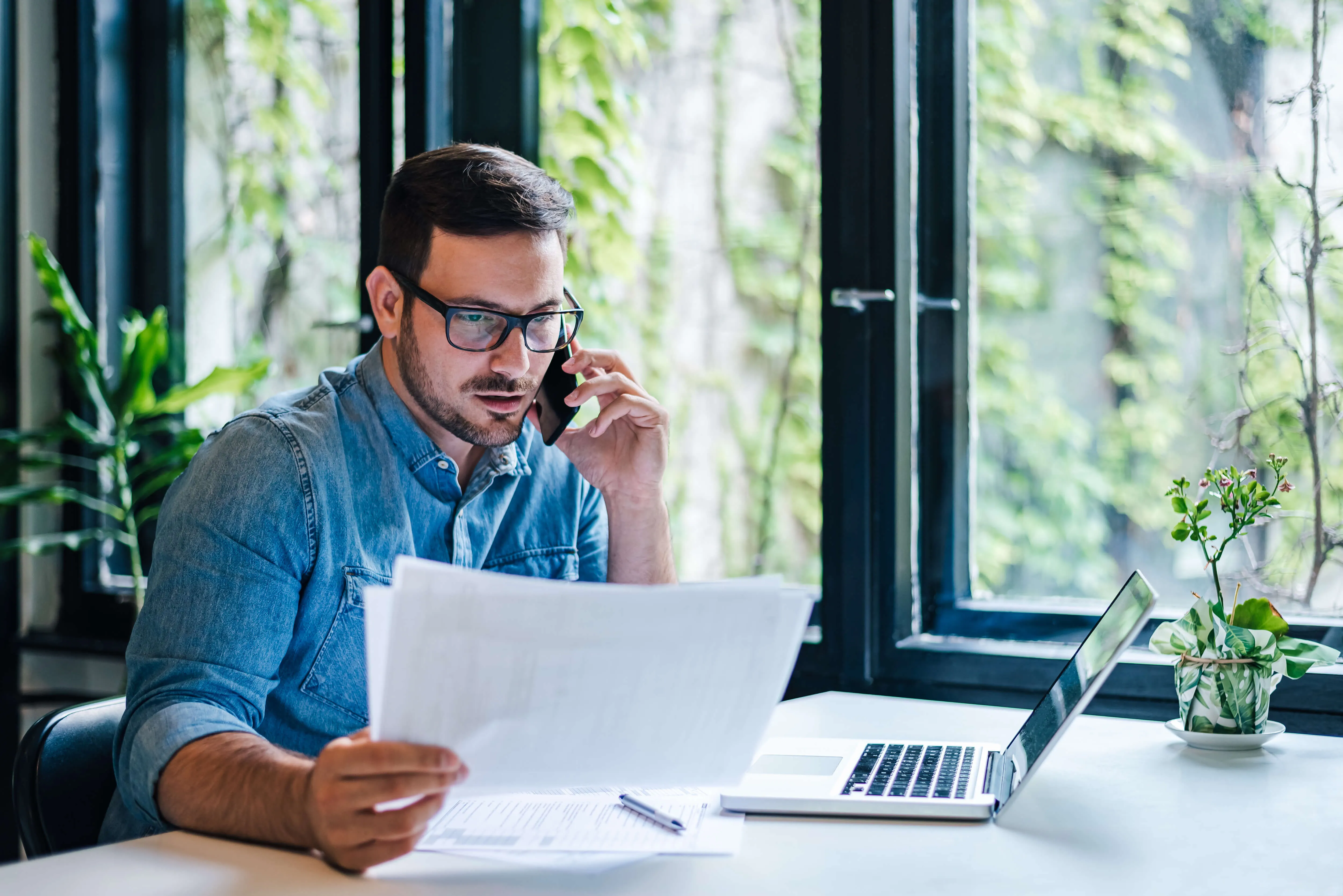 man-on-phone-and-computer.jpg